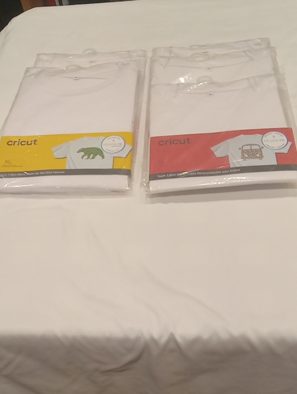 Infusible Ink. White T-shirts. Different Sizes. New In Pack. Males, females, and